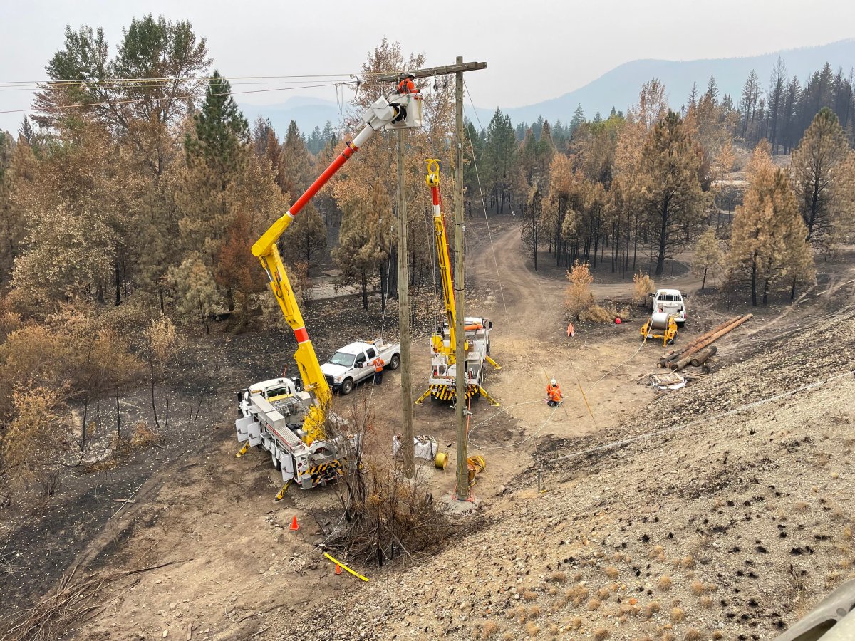 File photo of BC Hydro replacing power poles damaged by the Bush Creek East wildfire.