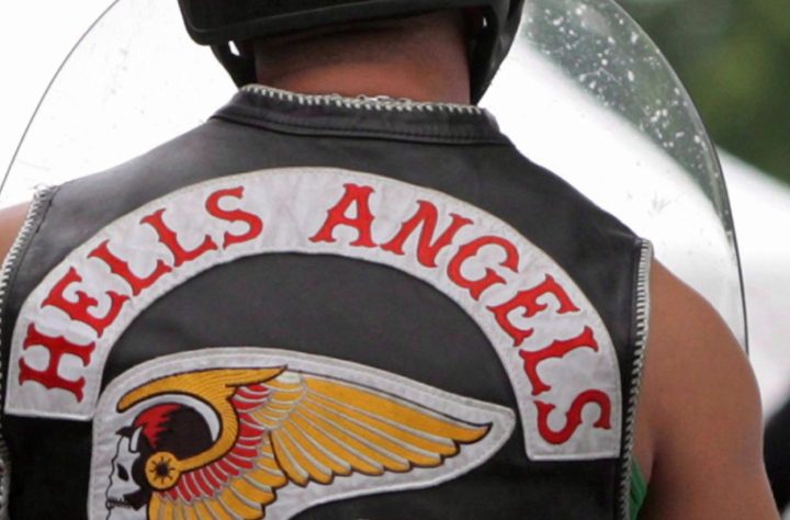 A member of the Hells Angels arrives at a property in Langley, B.C., in this file photo. 