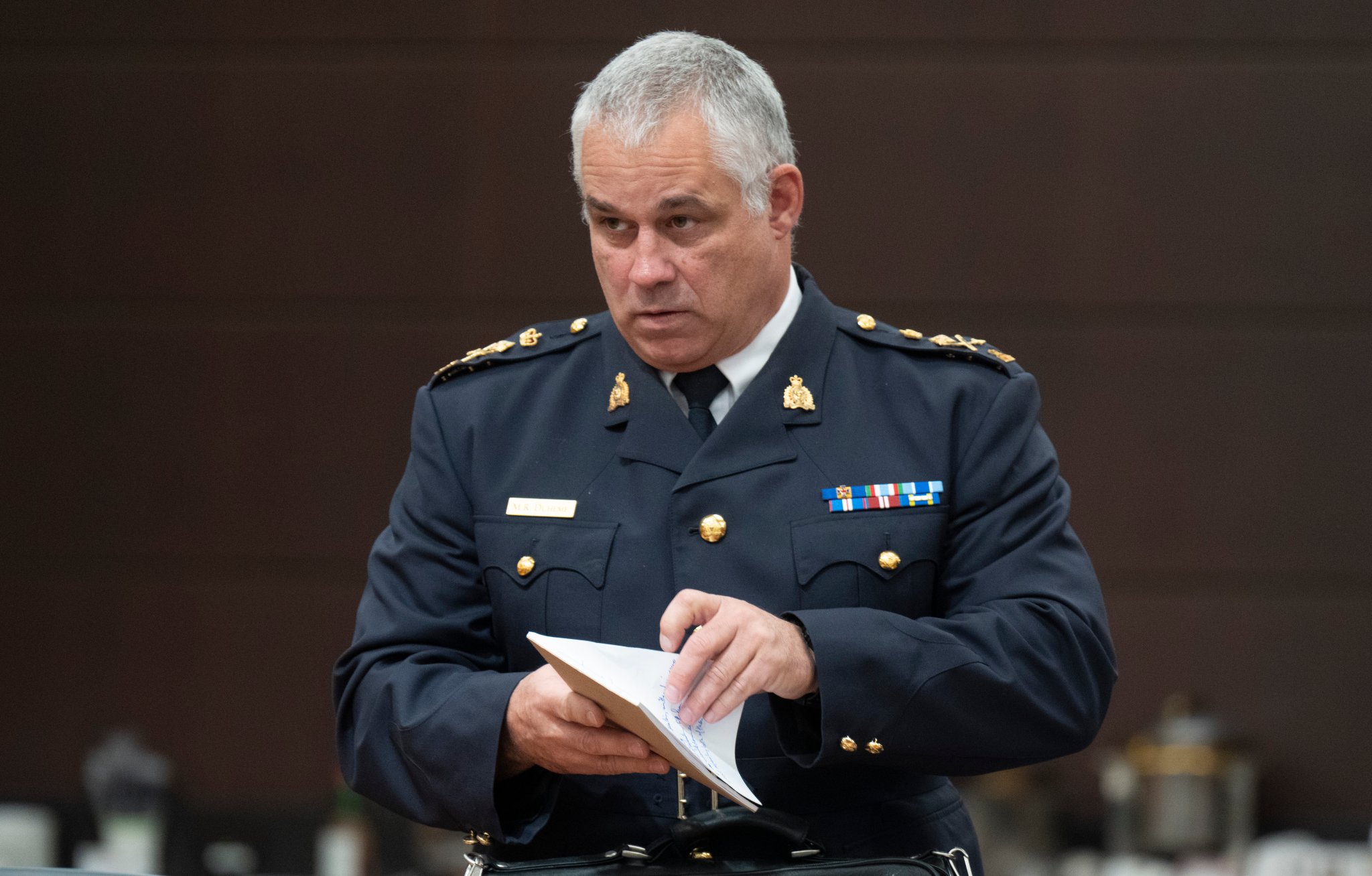 Acting RCMP Commissioner Mike Duheme waits to appear before the Procedure and House Affairs committee, in Ottawa, on June 13, 2023. THE CANADIAN PRESS/Adrian Wyld