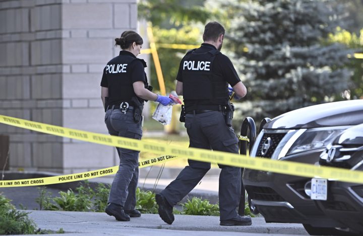 Ottawa Police officers collect evidence after a Saturday night shooting at the Infinity Convention Centre that left two dead, in Ottawa, on Sunday, Sept. 3, 2023.