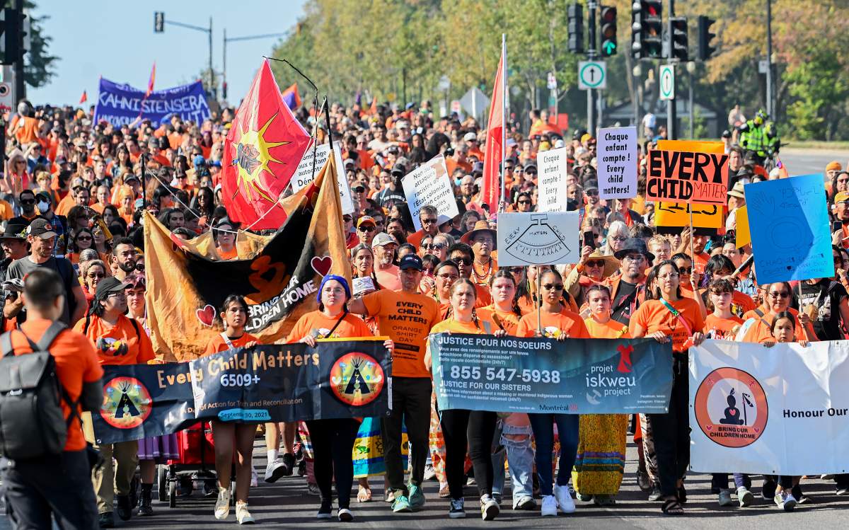People take part in a march on National Day for Truth and Reconciliation in Montreal, Saturday, September 30, 2023.