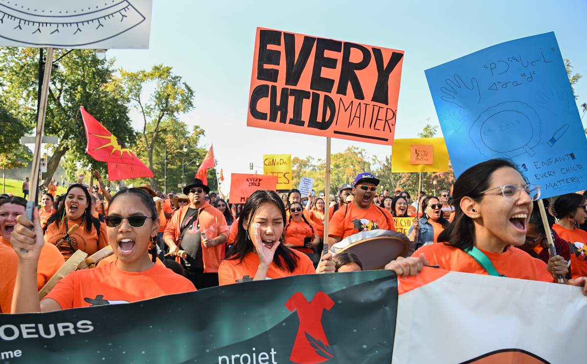 People take part in a march on National Day for Truth and Reconciliation in Montreal, Saturday, September 30, 2023.