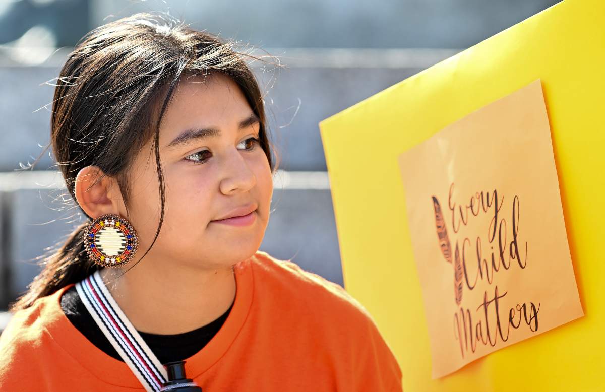 A young girl takes part in an event prior to a march on National Day for Truth and Reconciliation in Montreal, Saturday, September 30, 2023.