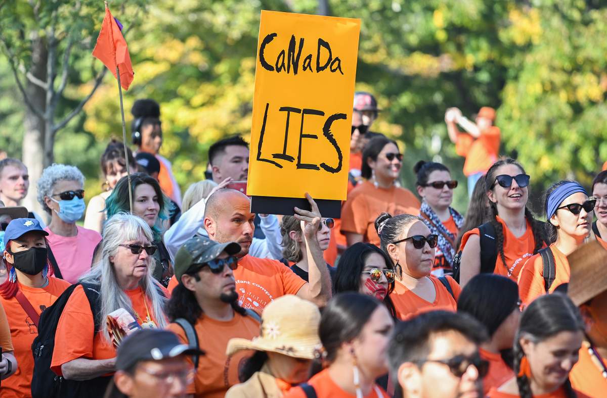 People take part in a march on National Day for Truth and Reconciliation in Montreal, Saturday, September 30, 2023.