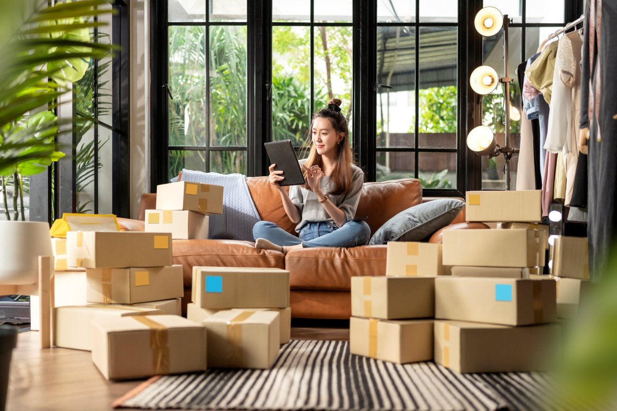 Woman on the couch with lots of online ordering boxes