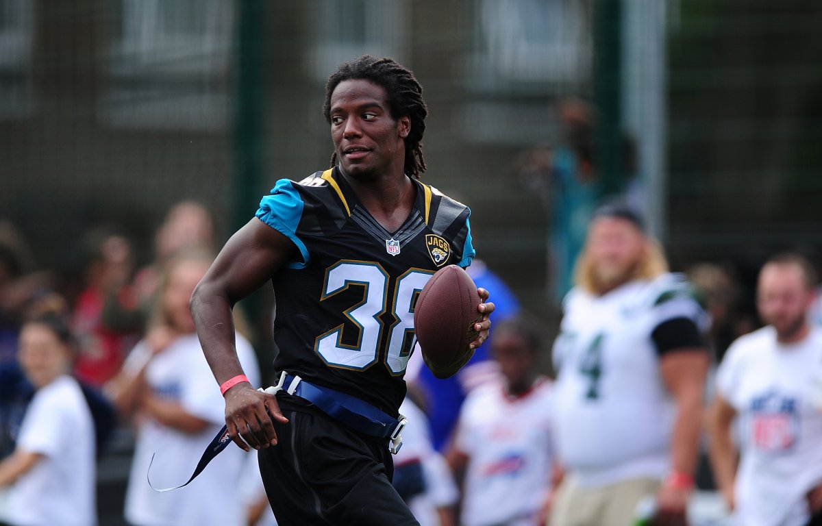 Sergio Brown of the Jacksonville Jaguars helps to coach a team of local school children during the NFL Launch of the Play 60 scheme at the Black Prince Community Hub on July 15, 2015 in London, England.