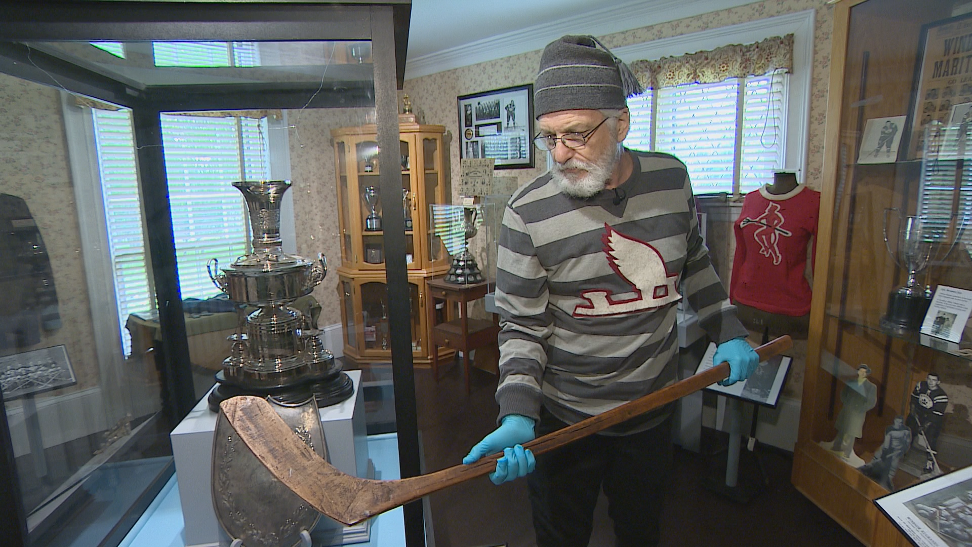 Hockey Holmes Heritage Detective David Foster Carter holds the Caruk stick.
