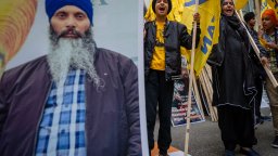 Protesters chant outside of the Consulate General of India office during a protest for the recent shooting of Hardeep Singh Nijjar in Vancouver on Saturday