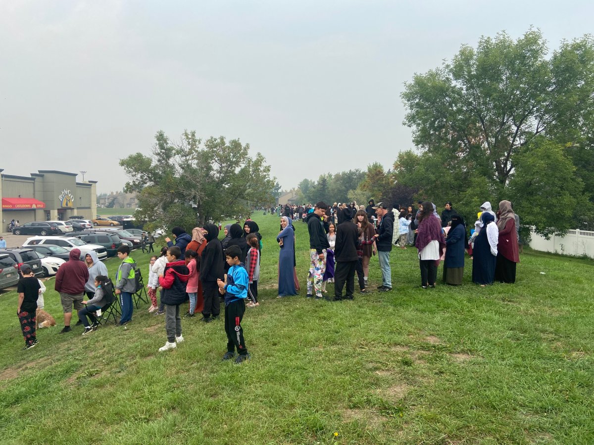 Hundreds, maybe thousands, of people line up for 'We're Here For Ya Day' to pick up free school supplies in Edmonton on Sunday.