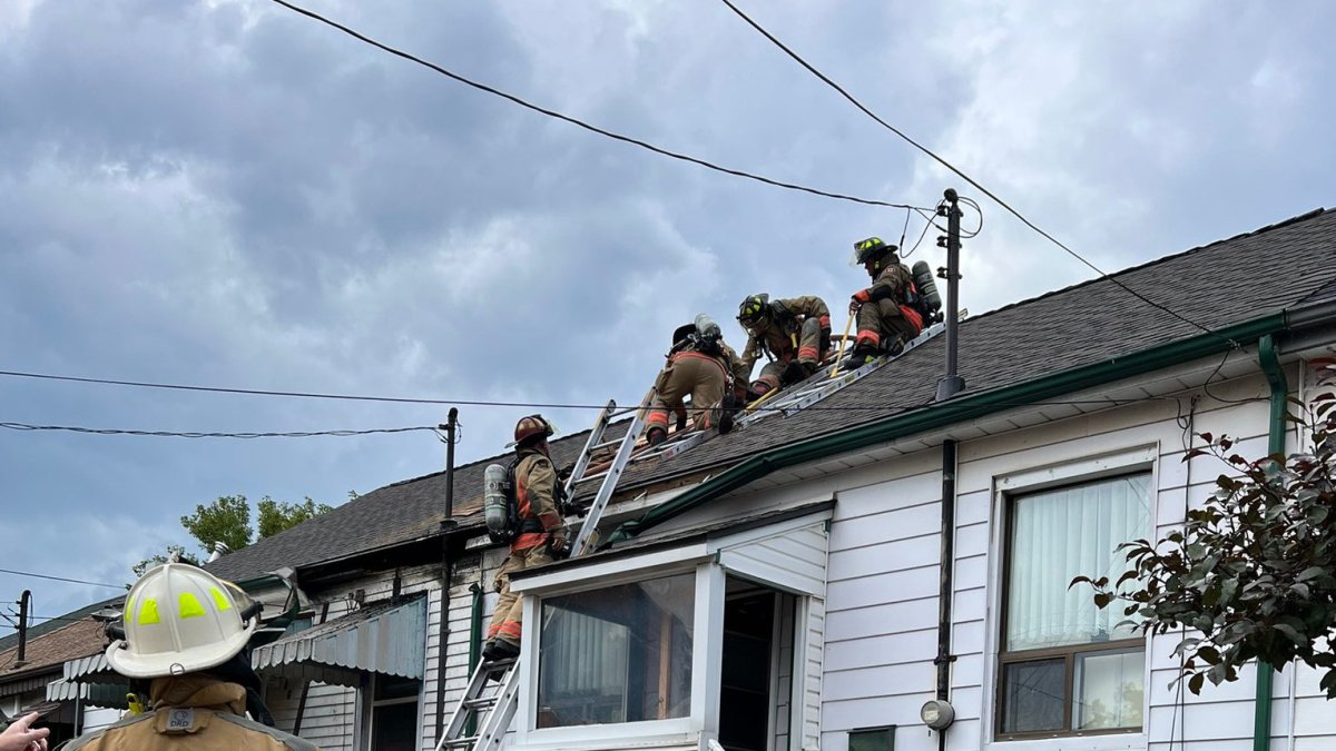 Firefighters battle a multiple-alarm blaze on Lochearne Street in Hamilton on Sept. 6, 2023.