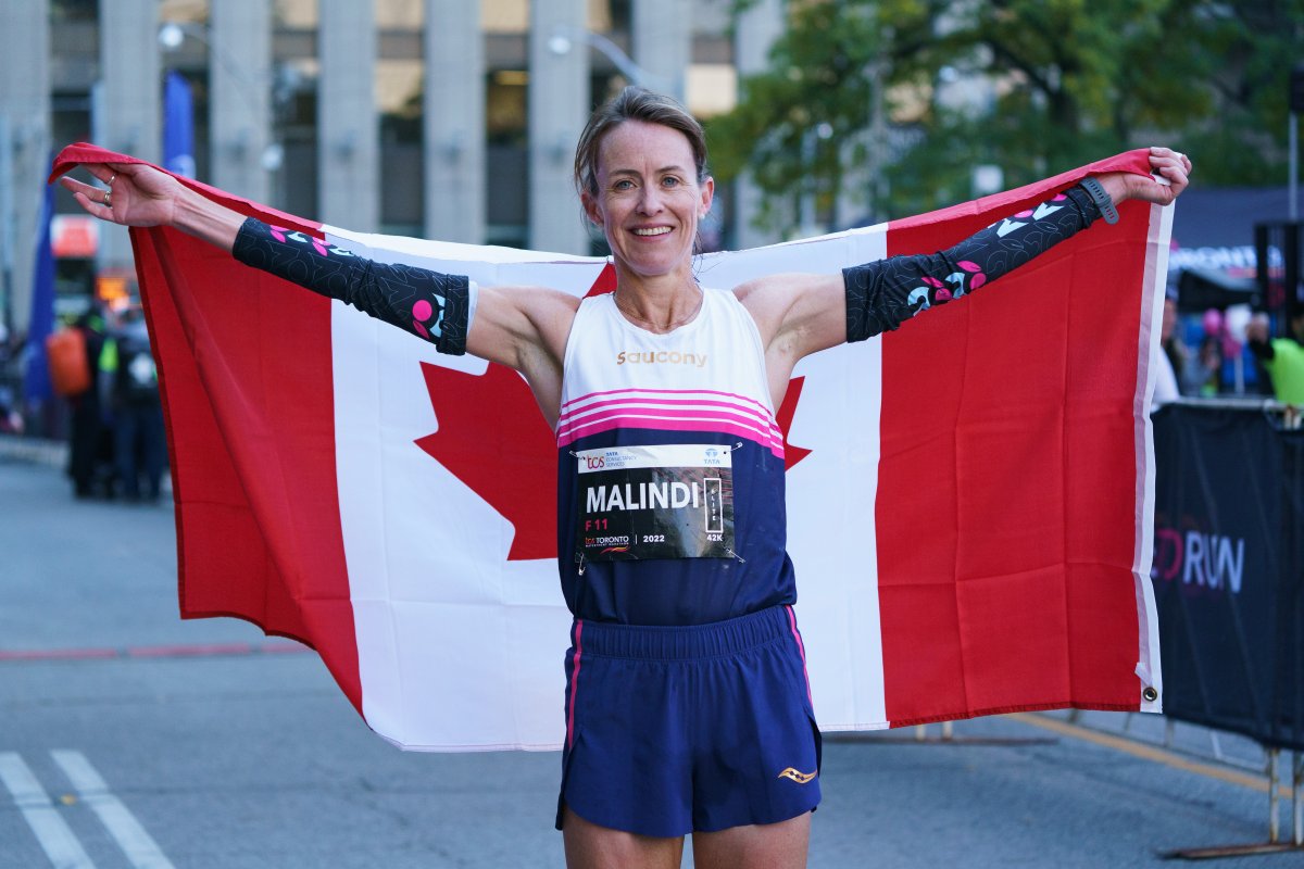 Malindi Elmore of Kelowna, seen here celebrating as the top Canadian female runner at the 2022 Toronto Waterfront Marathon.