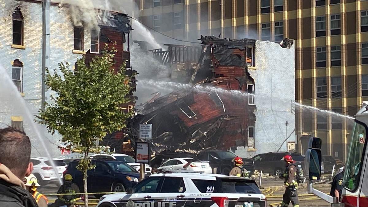 The south side of the Windsor Hotel collapsed after nearly three hours on fire.
