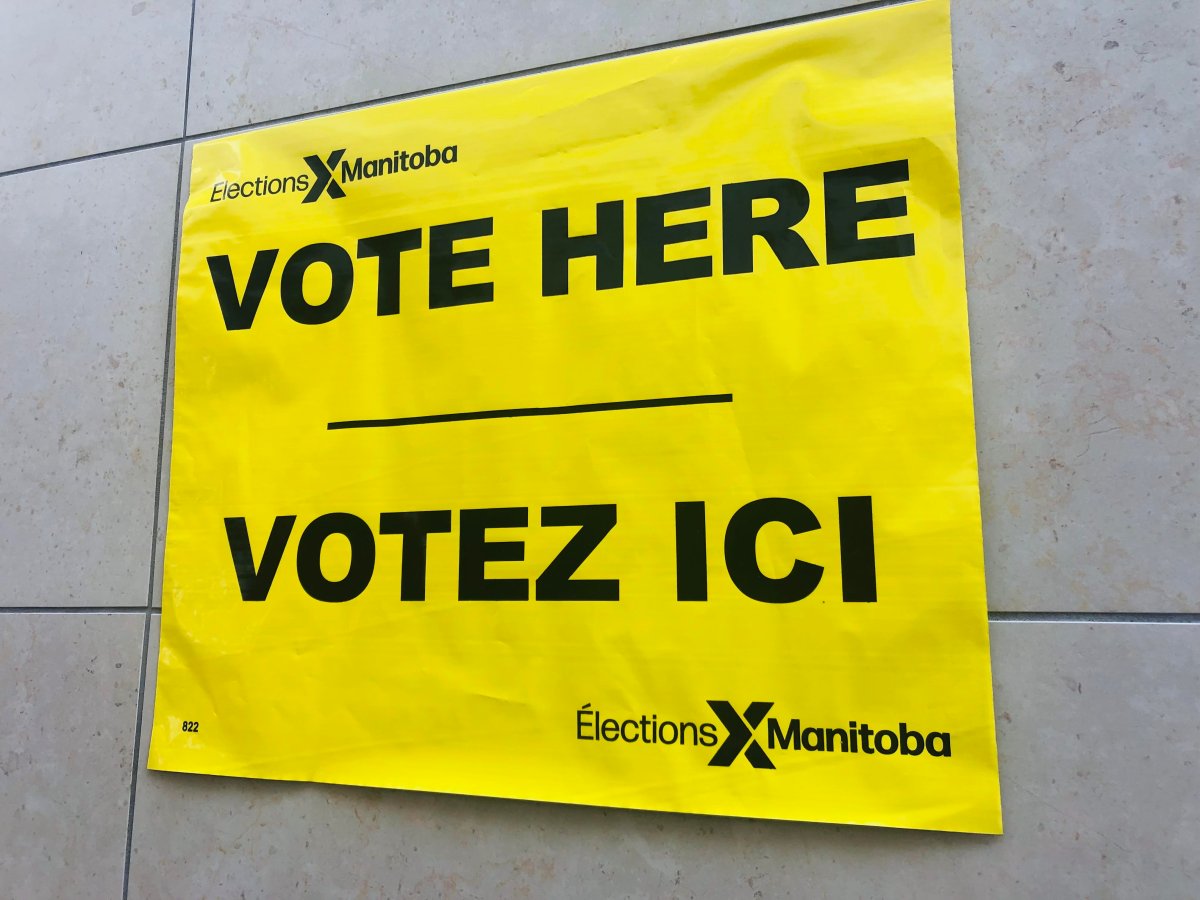 An Elections Manitoba 'vote here' sign.