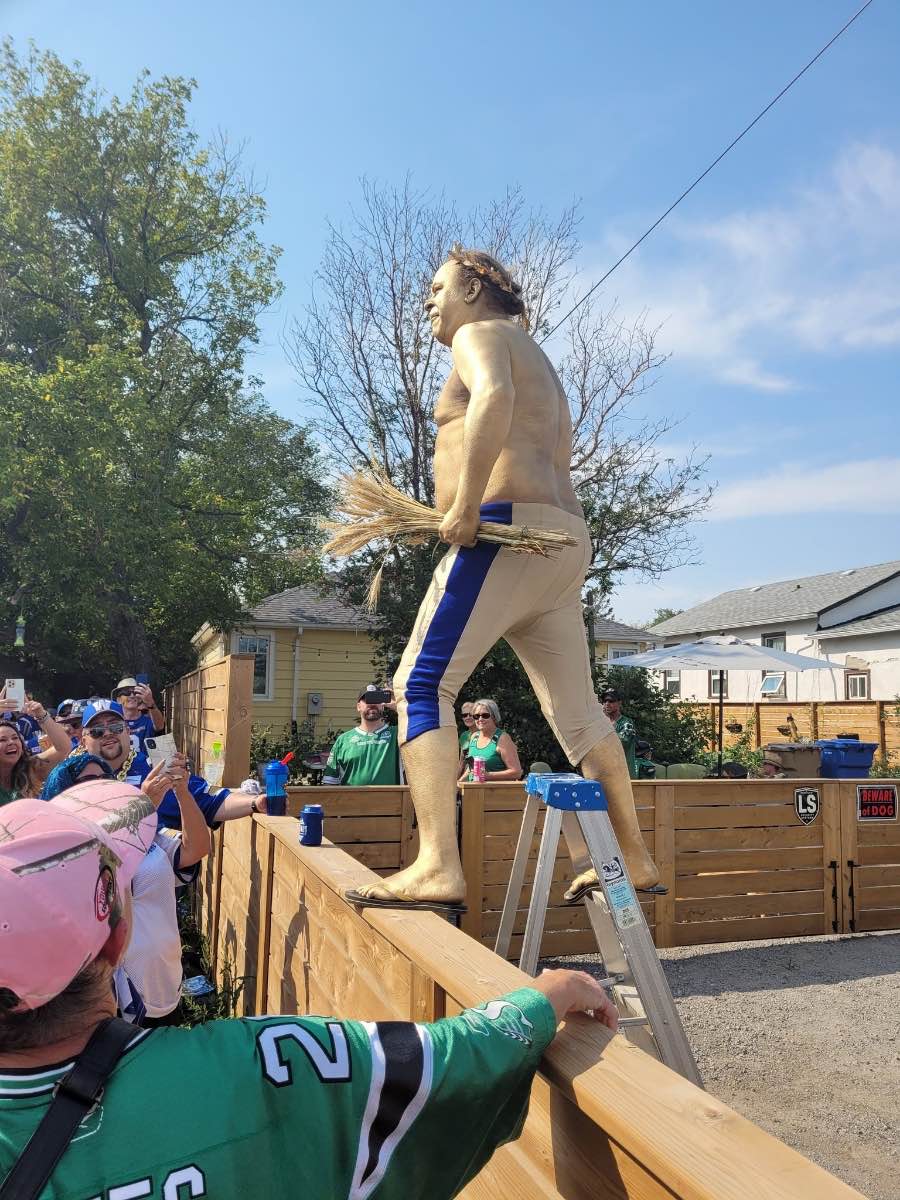 “Goldmember” entertains fellow Bombers (and Riders) fans.