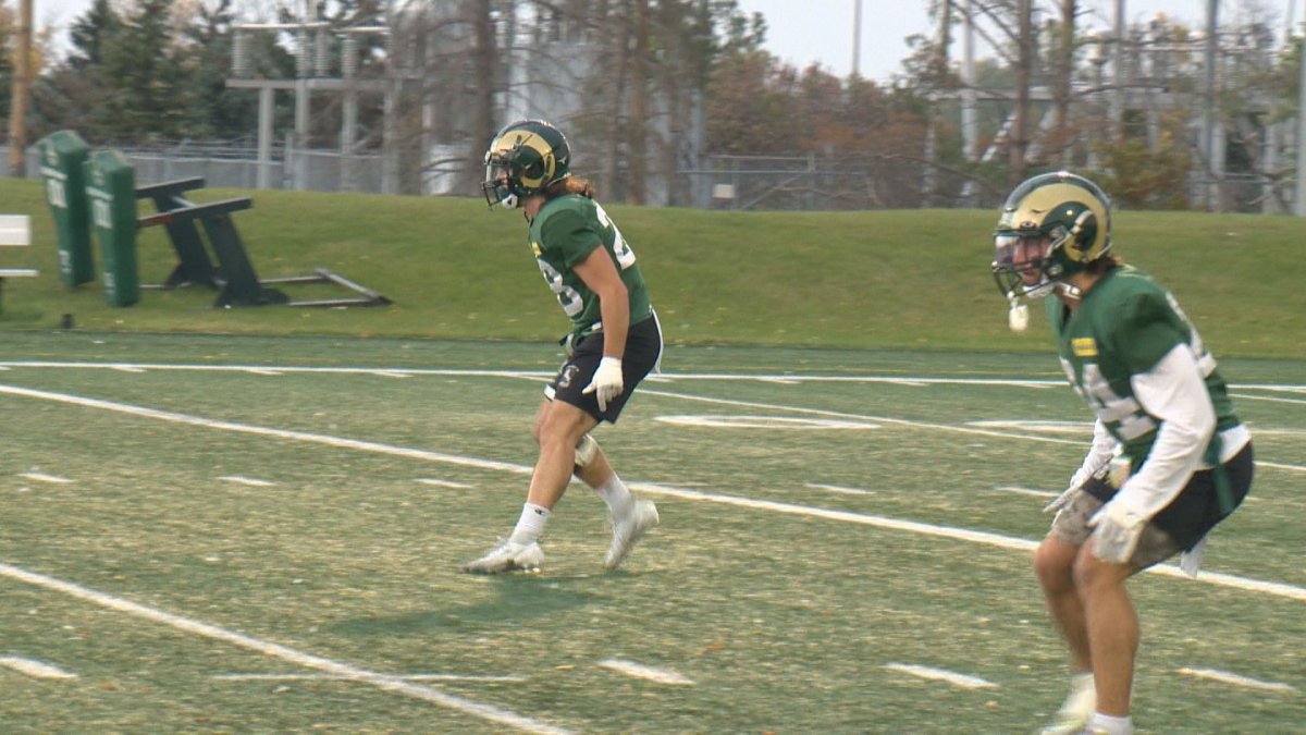Brothers Carson (left) and Jackson Sombach on the field during Regina Rams football pracitice.