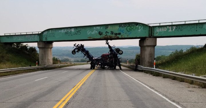 Semi-trailer carrying farm equipment collides with overpass on Hwy 10 near Minnedosa