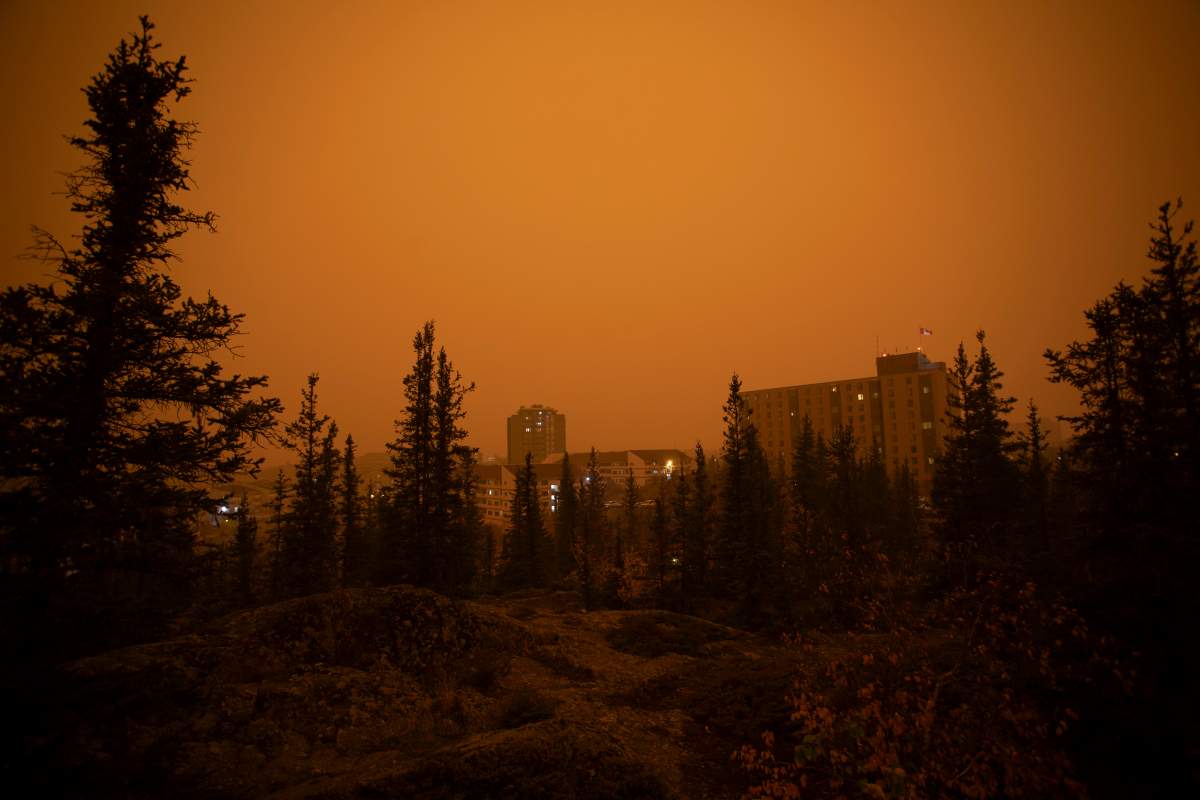 Heavy smoke from wildfires in northern Alberta and British Columbia fill the air at 9am Mountain Daylight Time in Yellowknife, Northwest Territories on Saturday, Sept. 23, 2023. THE CANADIAN PRESS/Bill Braden
