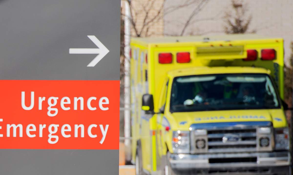 An ambulance is shown outside a hospital in Montreal, Saturday, January 15, 2022.