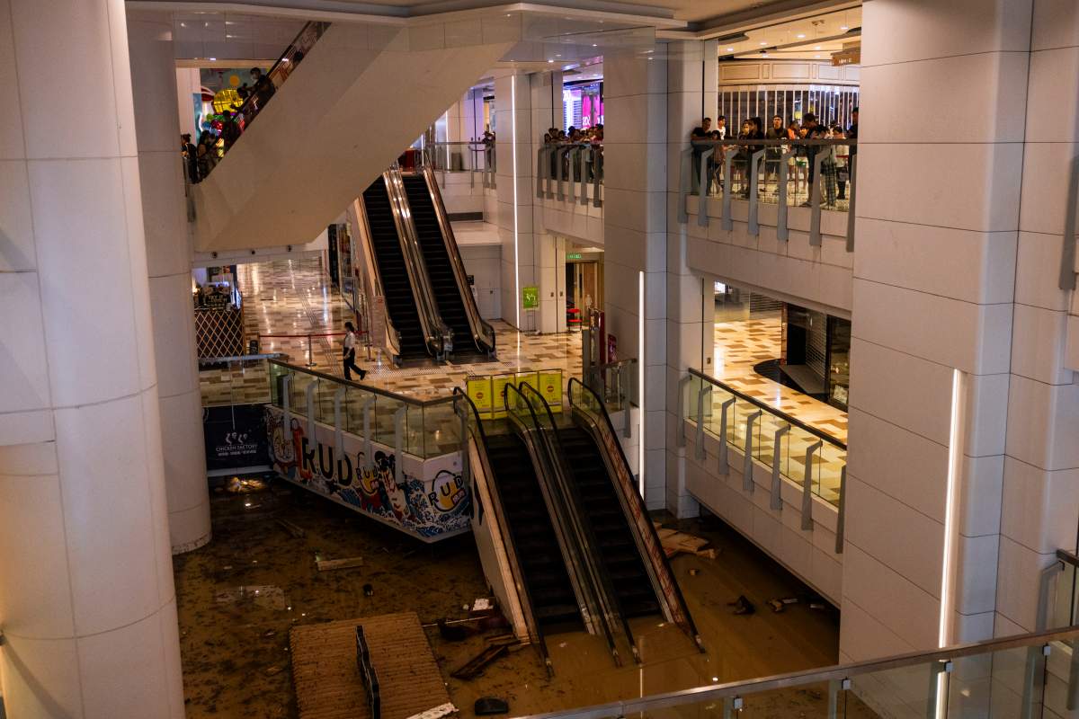A shopping mall is flooded following heavy rainstorms in Hong Kong, on Friday, Sept. 8, 2023. (AP Photo/Louise Delmotte)