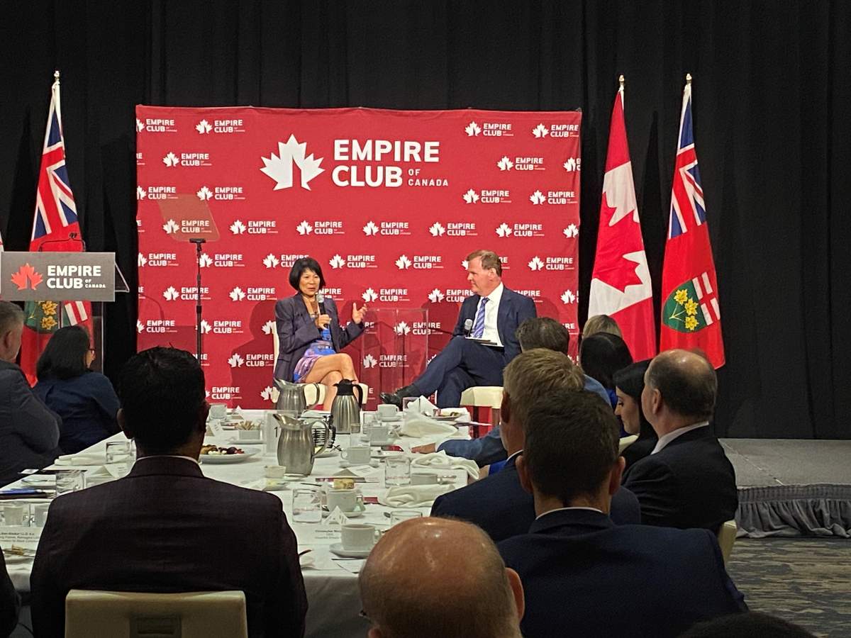 Toronto Mayor Olivia Chow speaks to former Conservative cabinet minister John Baird at an Empire Club luncheon on the city’s need for a new financial framework.