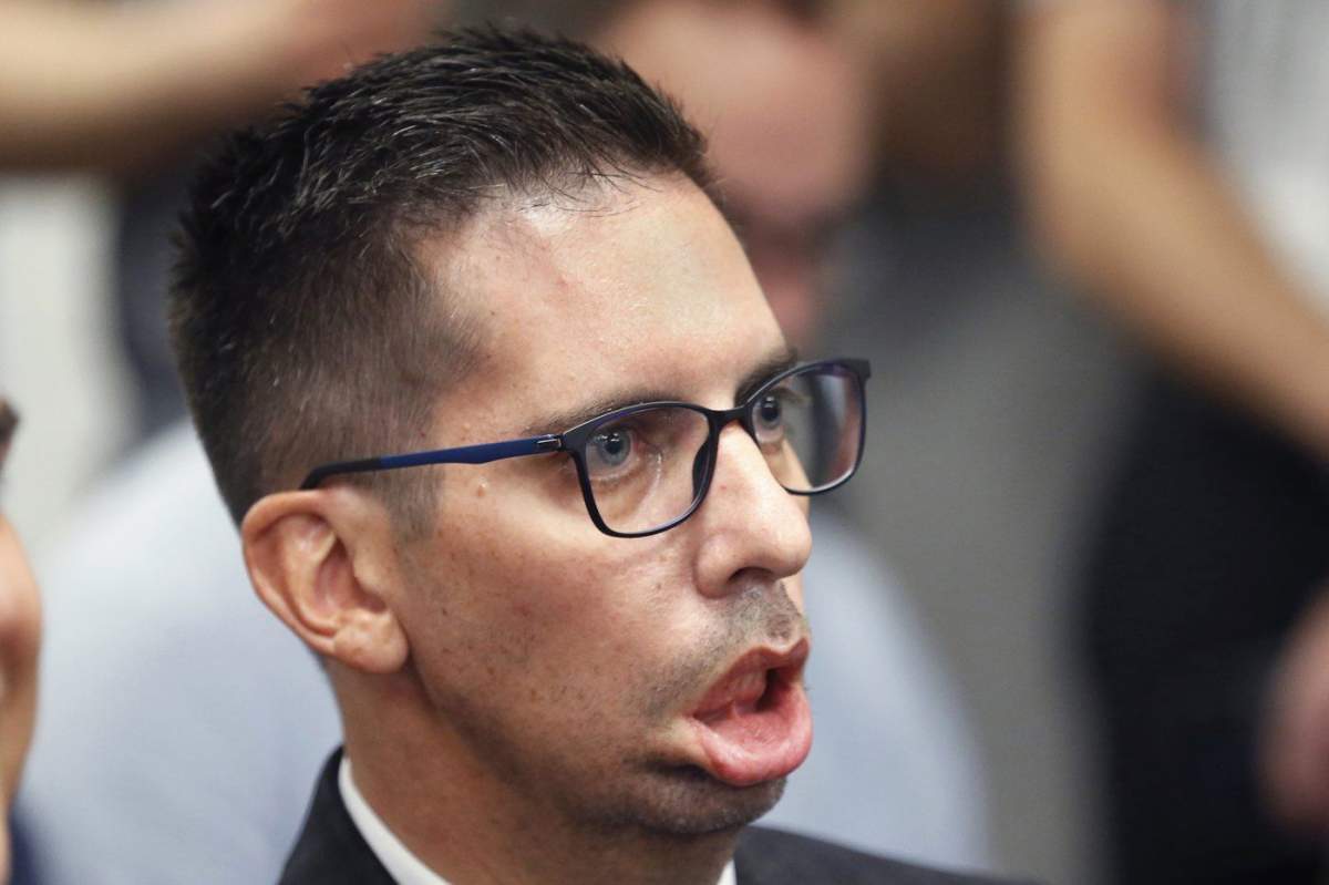 Chris Snow, who has ALS, Calgary Flames vice-president of data and analytics and assistant GM, attends a press conference in Calgary on May 23, 2023.