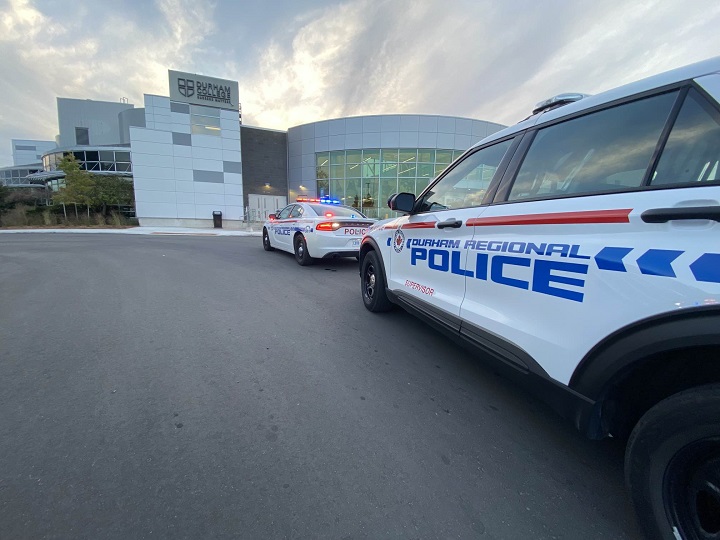 Police are seen at Durham College in Whitby on Monday after a student was stabbed.