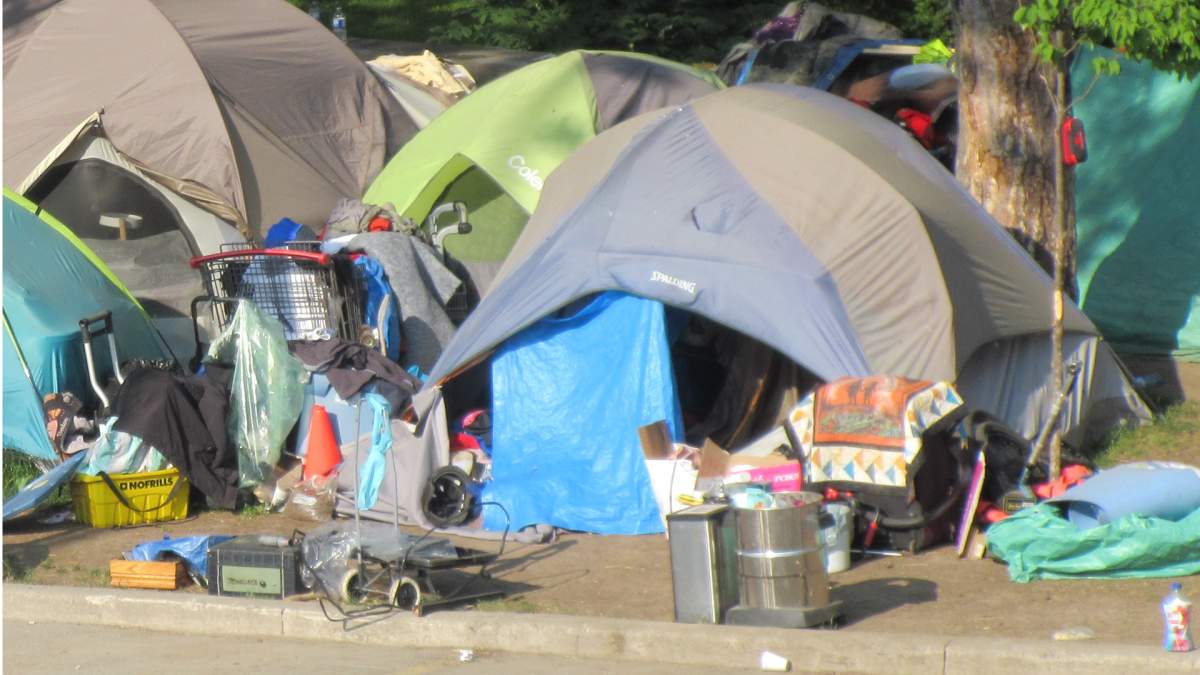 Police say no one was hurt following a blaze early Sept. 21, 2023 at an encampment near city hall in Hamilton, Ont.