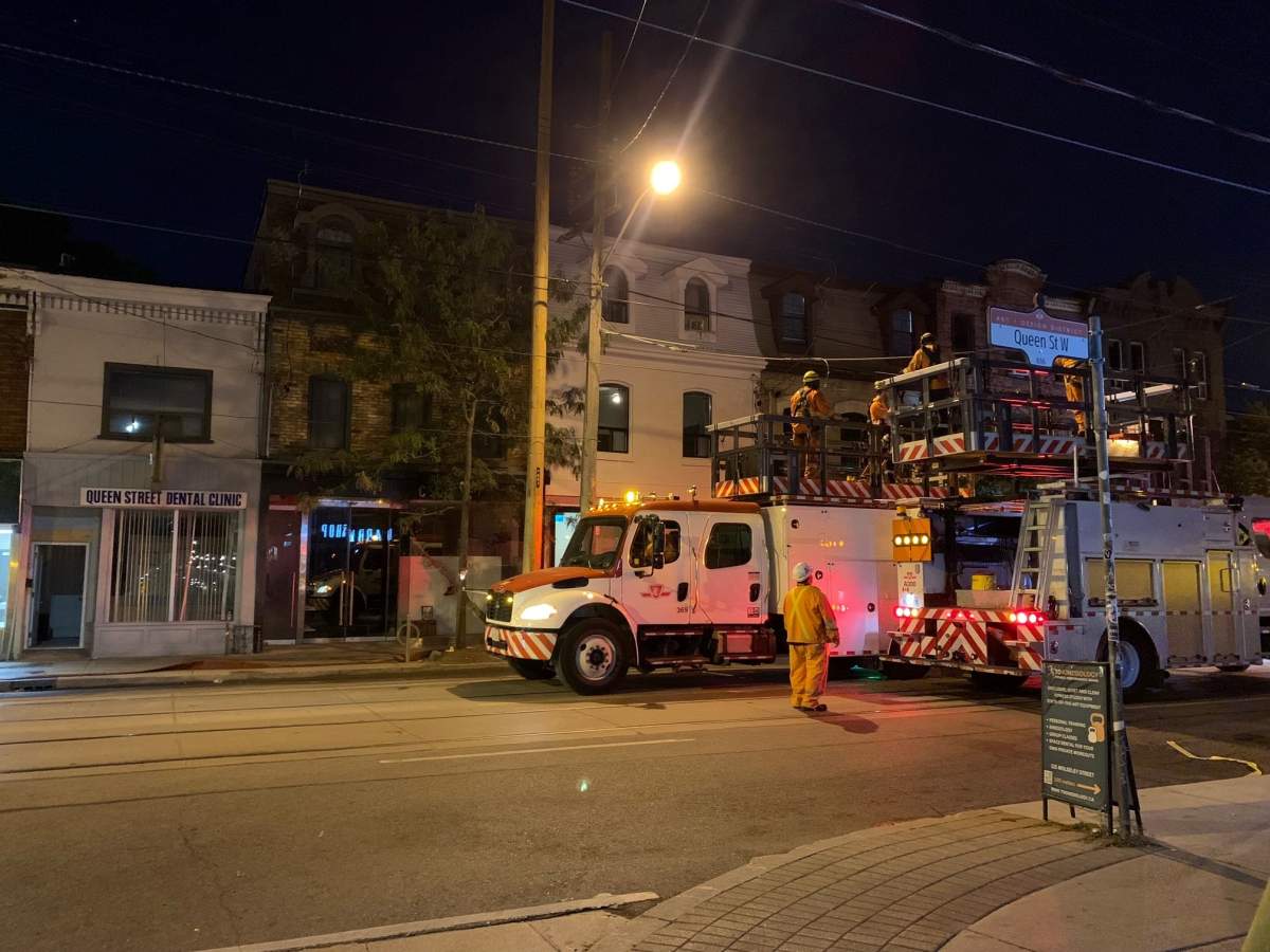 Crews on scene at a fire on Queen Street West on Sept. 27, 2023.