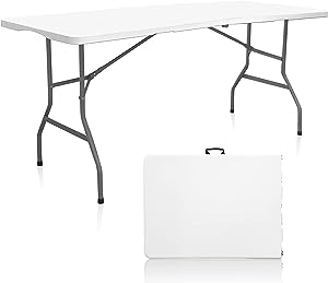 White six foot table that folds in half with metal legs