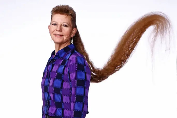 Tami Manis shows off the length of her world record-setting mullet.