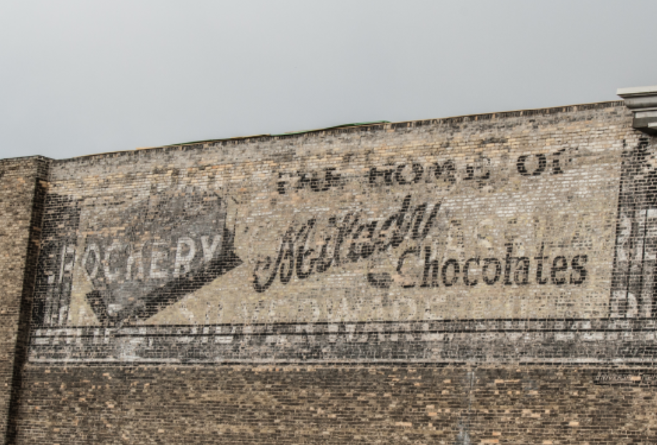 The 'Porter Milady' sign on McDermot Street. This weekend, the two layers of this 'ghost sign' will be illuminated.