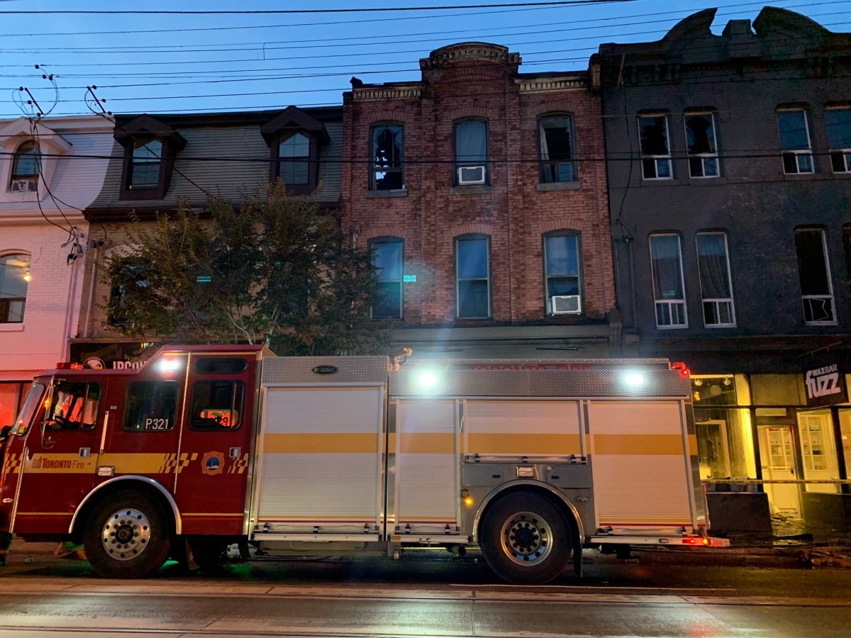 Crews on scene at a fire on Queen Street West on Sept. 27, 2023.