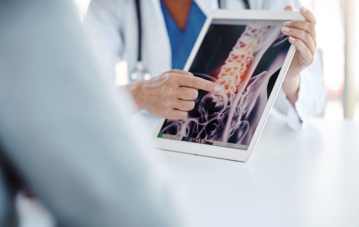 Shot of a doctor showing her patient his scan on a digital tablet. A record number of Albertans are looking for a family doctor, says Primary Care Networks.