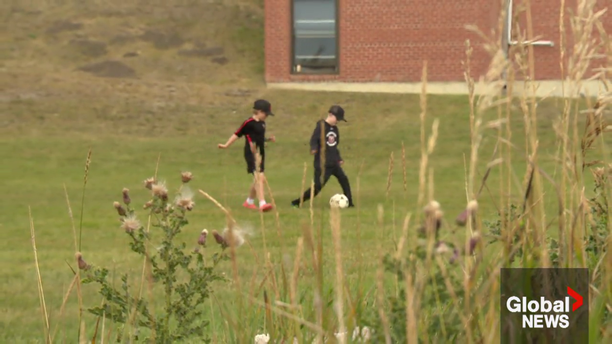 Easton Beatch and Bennett Love playing soccer.