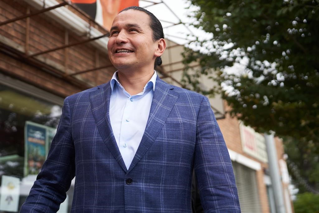 Manitoba NDP Leader Wab Kinew greets candidates and supporters at the St. Boniface campaign office on election day in Winnipeg, Tuesday, Oct. 3, 2023. THE CANADIAN PRESS/David Lipnowski.