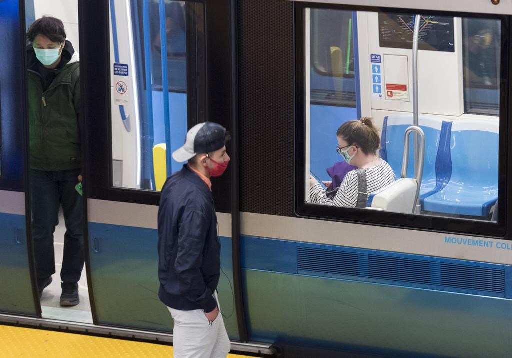Montreal's public transit authority is poised to equip its security officers with cayenne pepper aerosol gel, pending approval from its board at a meeting this evening. People wear face masks as they commute via metro in Montreal, Saturday, Oct. 17, 2020. 