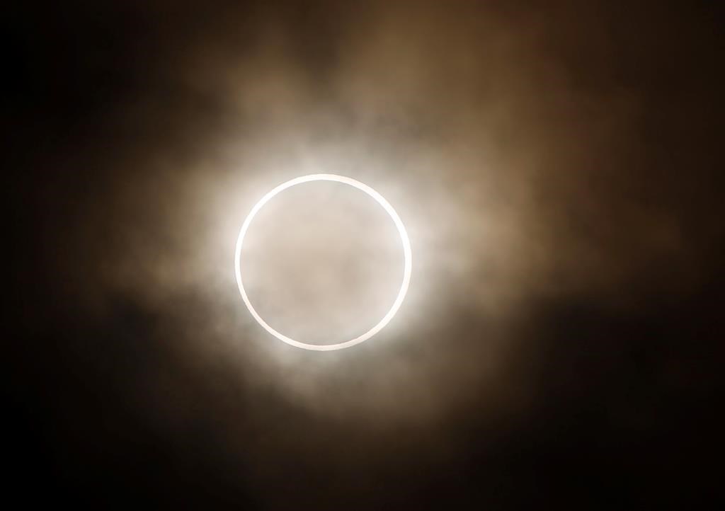 FILE - An annular eclipse is viewed from a waterfront park in Yokohama, Japan, near Tokyo, Monday, May 21, 2012. On Saturday, Oct. 14, 2023, an annular solar eclipse -- better known as a ring of fire -- will briefly dim the skies over parts of the western U.S. and Central and South America. Proper protection is needed throughout the eclipse, from the initial partial phase to the ring of fire to the final partial phase. (AP Photo/Shuji Kajiyama, File).