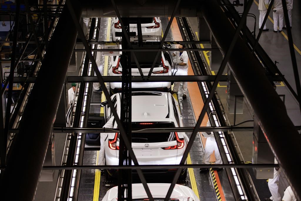 A general view of production along the production line is shown during a tour of a Honda manufacturing plant in Alliston, Ont., Wednesday, Apr. 5, 2023. Japanese automaker Honda says it will start producing the Civic Hybrid next year at its plant in Alliston, Ont.THE CANADIAN PRESS/Cole Burston.