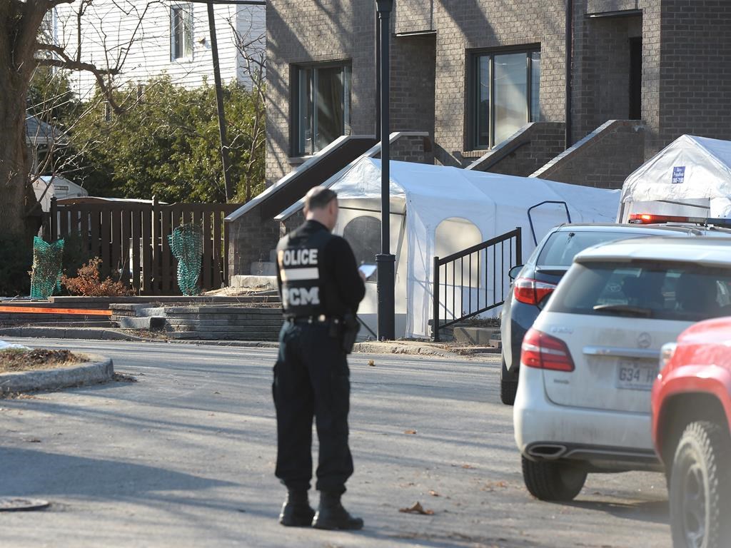 Police canvas the area outside a home after the discovery of three bodies in an east-end home, Wednesday, Dec.11, 2019.  THE CANADIAN PRESS/Ryan Remiorz.