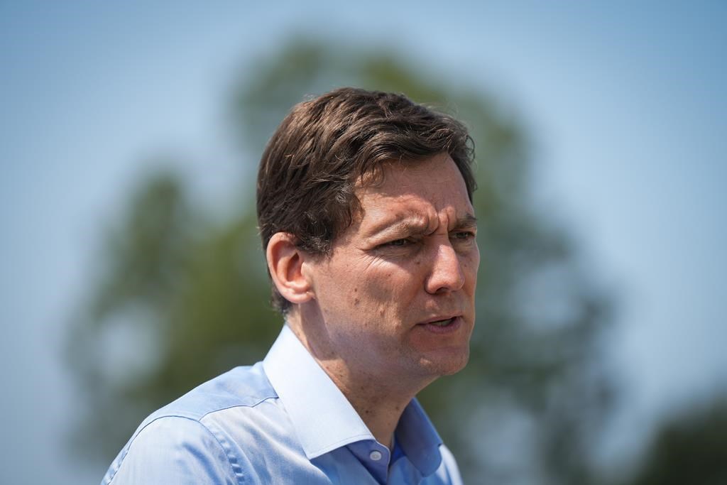 B.C. Premier David Eby speaks during a news conference in Vancouver on Monday, June 26, 2023. Eby is asking for the federal government to extend its subsidies on heat pumps to his province.