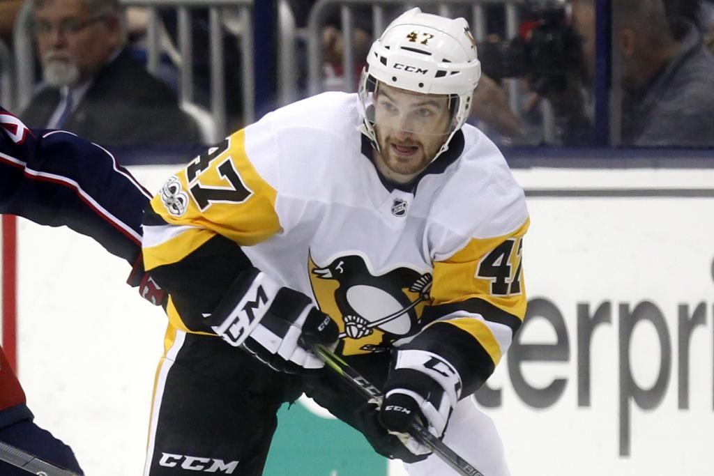 FILE – Pittsburgh Penguins forward Adam Johnson in action during an NHL hockey game in Columbus, Ohio, Friday, Sept. 22, 2017. American hockey player Adam Johnson has died after a “freak accident” during a game in England on Saturday, Oct. 28, 2023 his club said. The 29-year-old Minnesota native was playing for the Nottingham Panthers in a Challenge Cup game against the Sheffield Steelers when he suffered a slashed neck during the second period of the game at Sheffield’s Utilita Arena. (AP Photo/Paul Vernon, file)