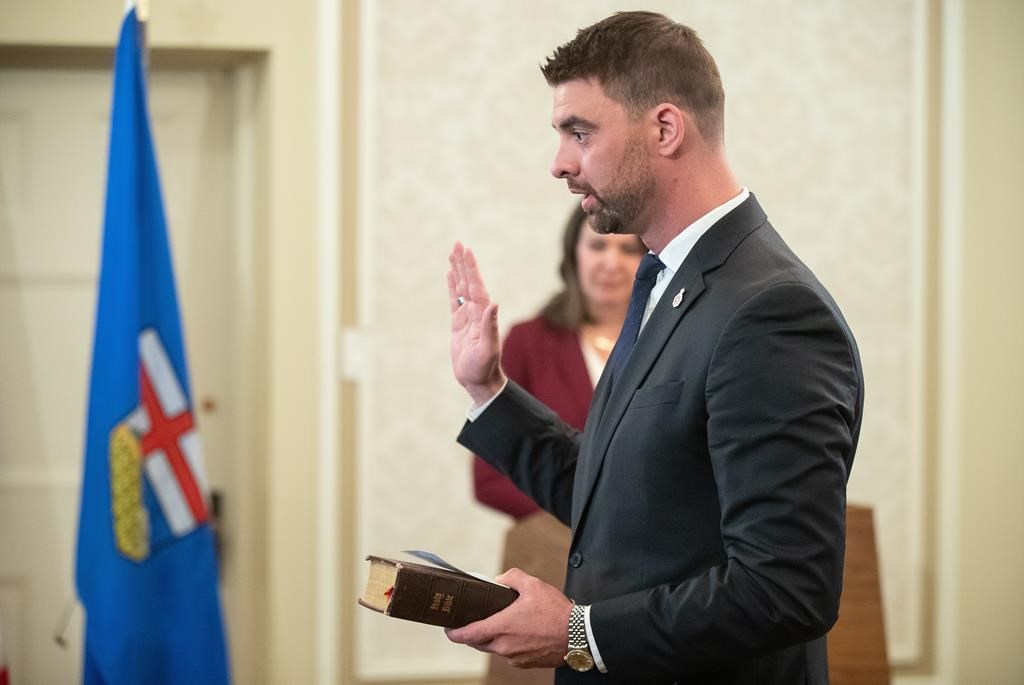 Dan Williams, Alberta's minister of mental health and addiction, has introduced updated legislation that it says would help make sure anyone who contributed to the opioid addiction crisis is held responsible. Williams is sworn into cabinet, in Edmonton on Friday, June 9, 2023.
