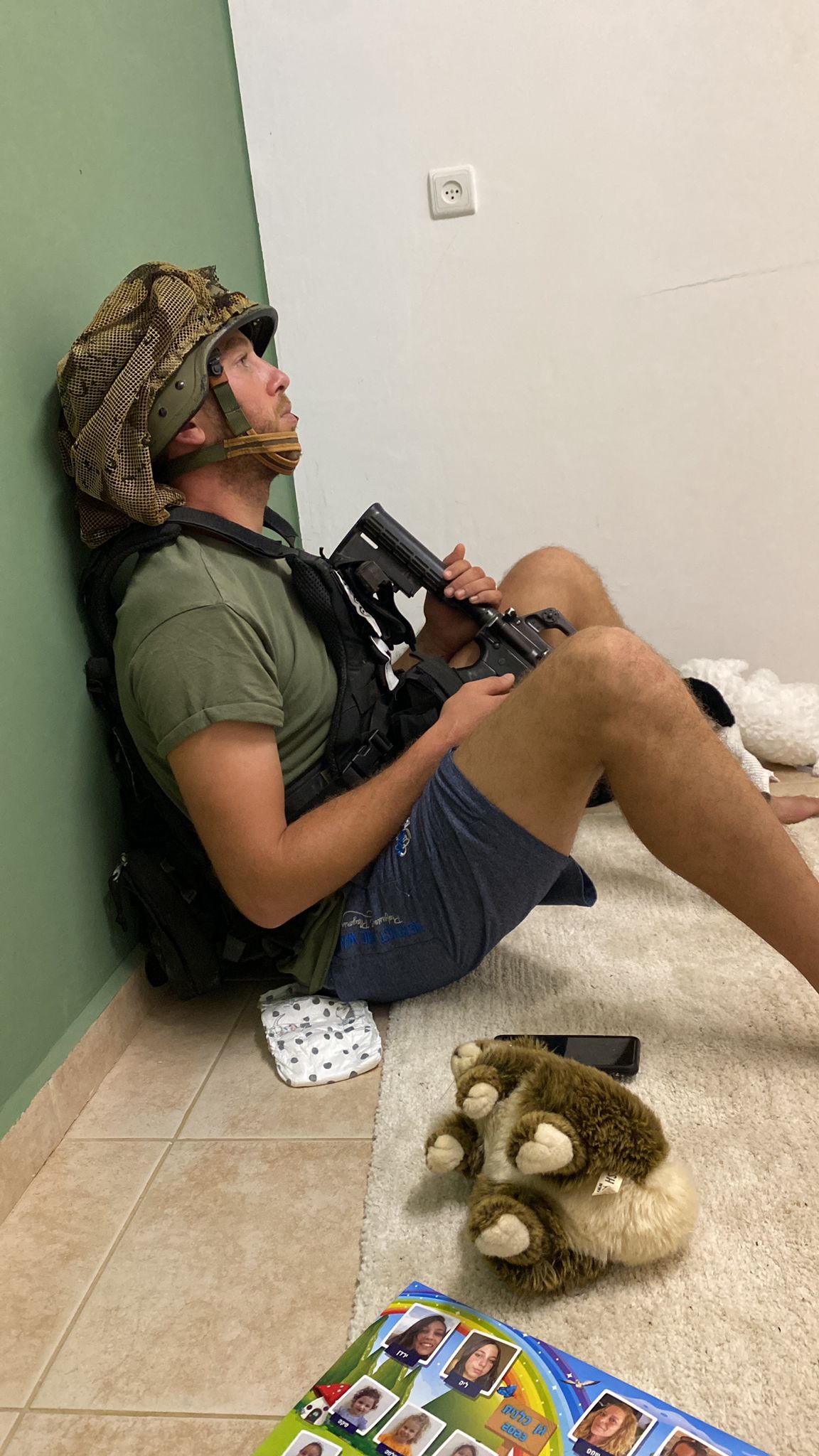 Yuval Balacasan prepares to confront the Hamas attack on Sufa, where he lives with his wife and son.