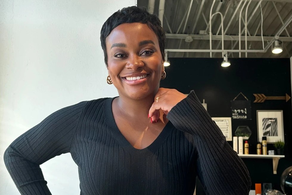 Kayleigh Butler, a hair stylist, stands for a portrait at her studio in Atlanta on Tuesday, Oct. 17, 2023. “Relaxers have taken an extreme decline ... as we became more knowledgeable about the effects of the relaxer on your hair and what it can do to your hair,” says Butler, who remembers getting relaxers when she was 5 years old. She added: “I think people just wanted to move away from that and live a healthier lifestyle.” (AP Photo/Kenya Hunter)
