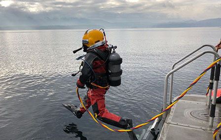 An RCMP diver about to enter the water.