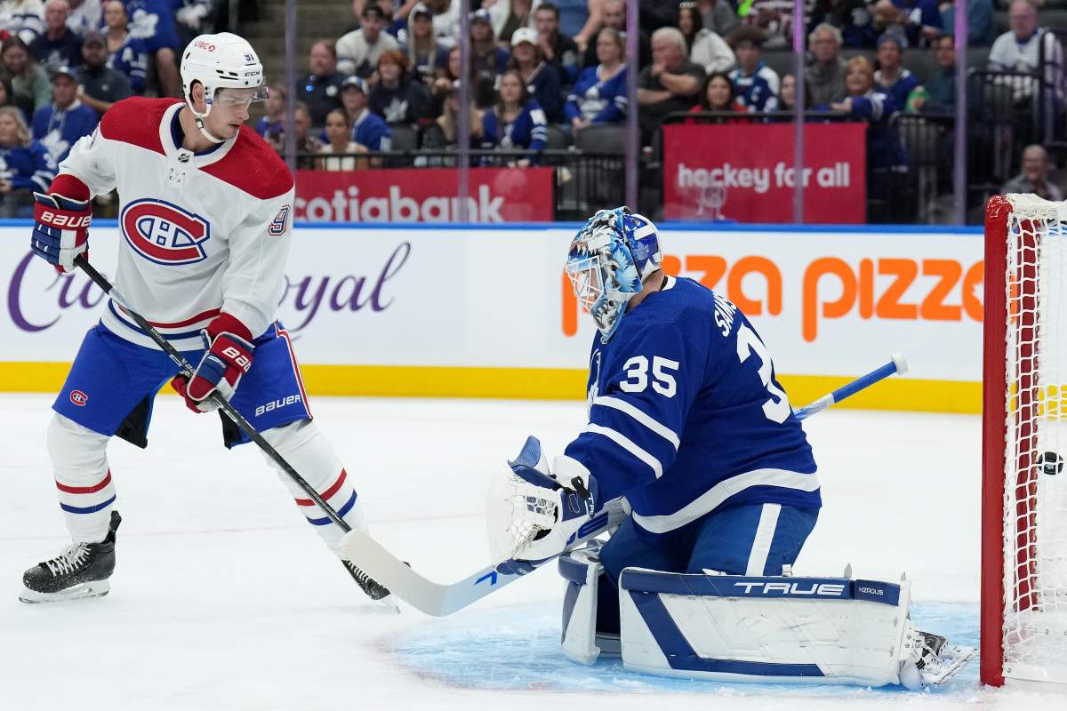 Montreal Canadiens centre Sean Monahan (91) looks on as Toronto Maple Leafs goaltender Ilya Samsonov (35) allows a goal during first-period NHL pre-season hockey action in Toronto, Monday, Oct. 2, 2023.