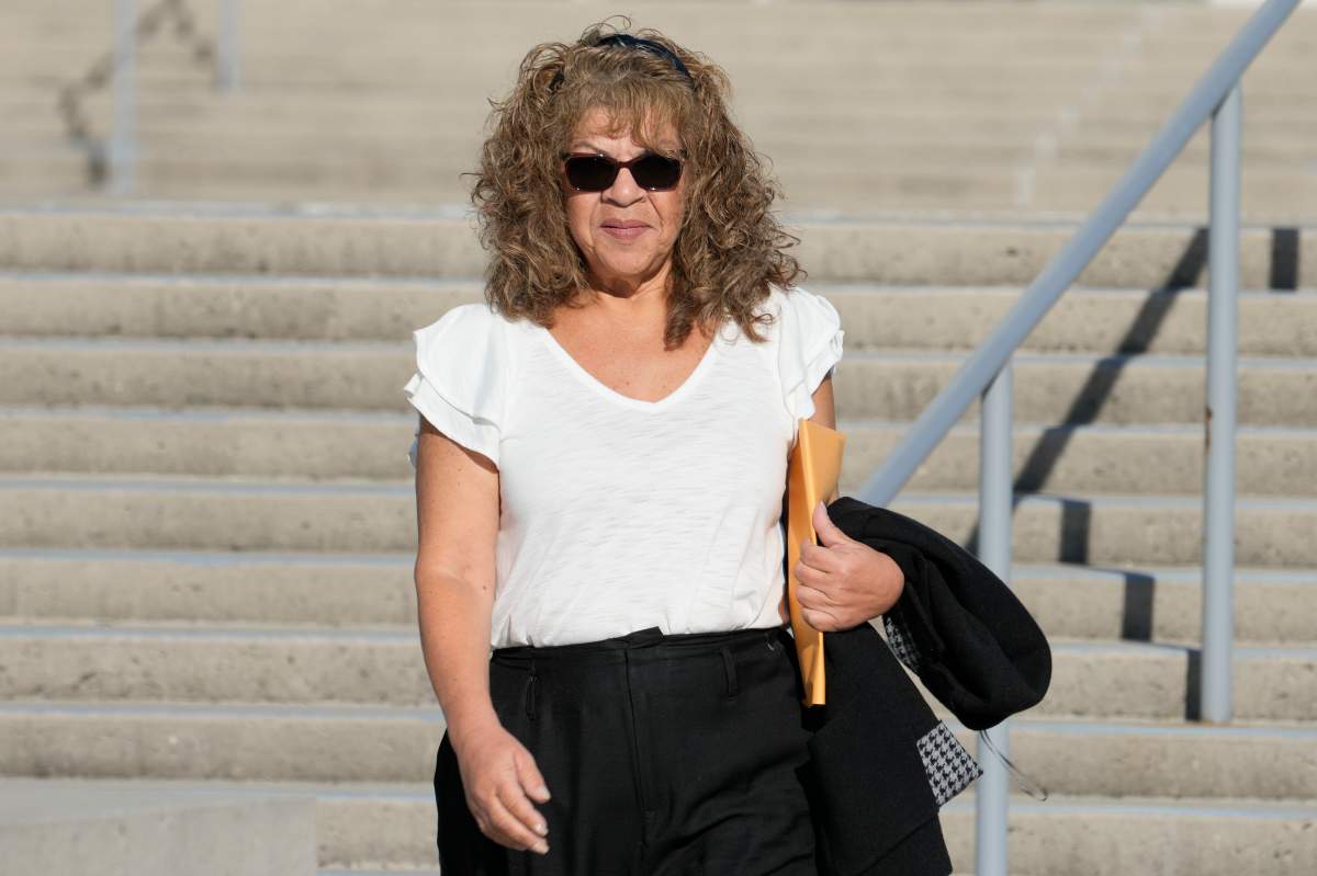 Nancy Marks leaves federal court, Thursday, Oct. 5, 2023, in Central Islip, N.Y. Marks, the ex-campaign treasurer for U.S. Rep. George Santos pleaded guilty Thursday to conspiring to defraud the U.S. government and implicated the indicted New York Republican in court with submitting bogus campaign finance reports. (AP Photo/Mary Altaffer)