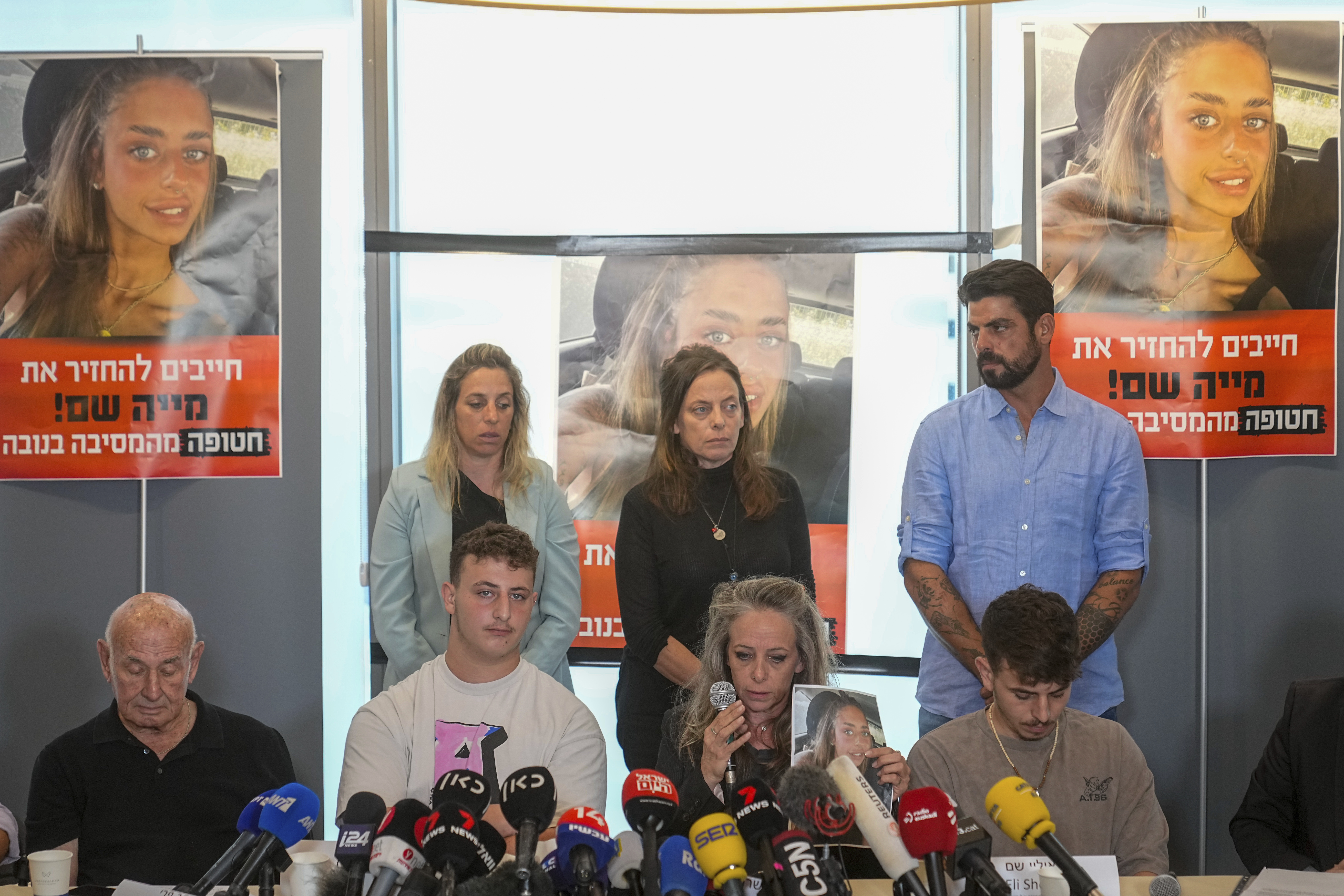 The family of Mia Schem at press conference on Tuesday following the release of a video by Hamas, in which the 21-year-old Israeli woman is seen. (AP Photo/Ohad Zwigenberg)