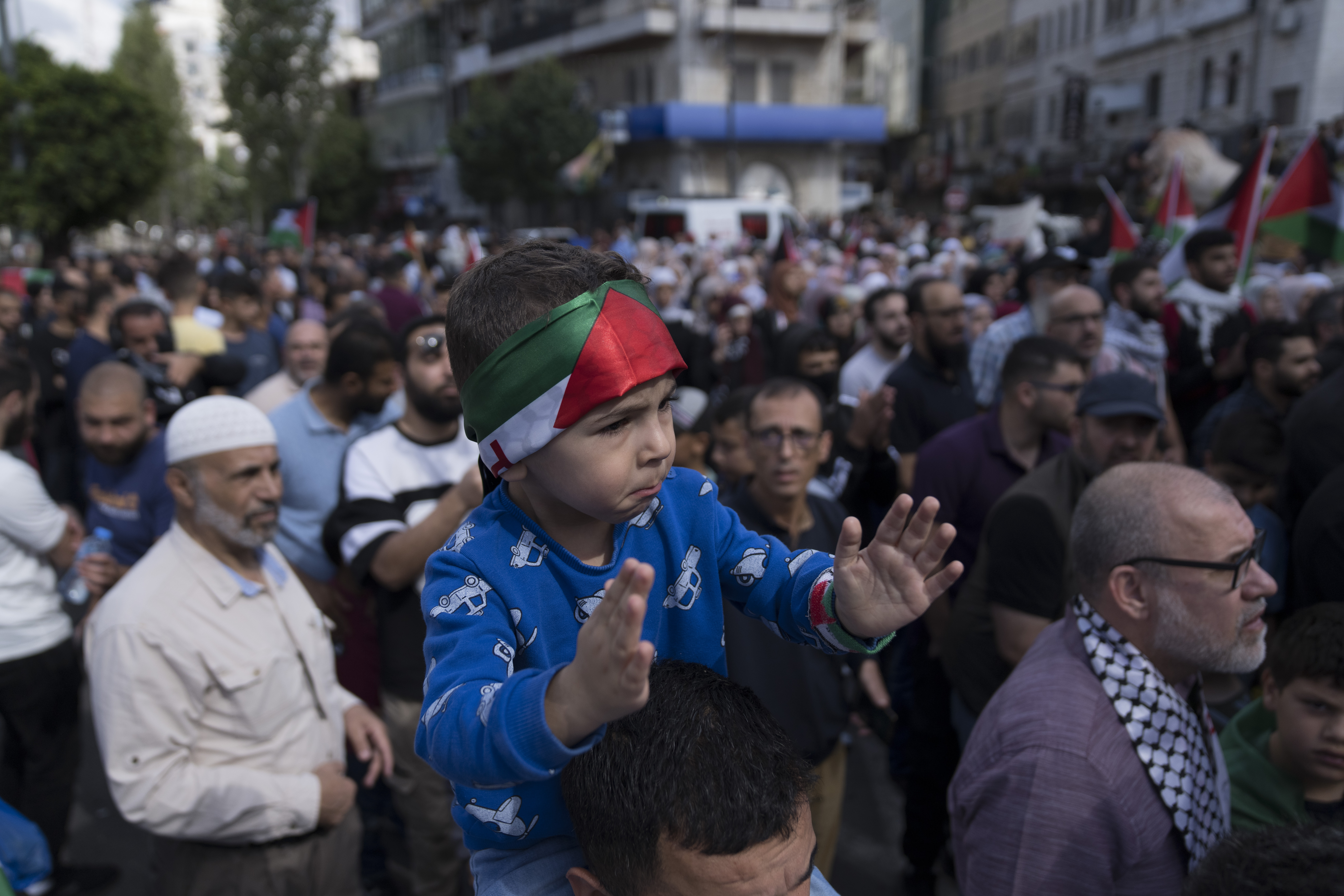 Palestinian protesters chant anti-Israel slogans during a demonstration in solidarity with the Gaza Strip, in the West Bank city of Ramallah, Friday, Oct. 20, 2023. (AP Photo/Nasser Nasser)