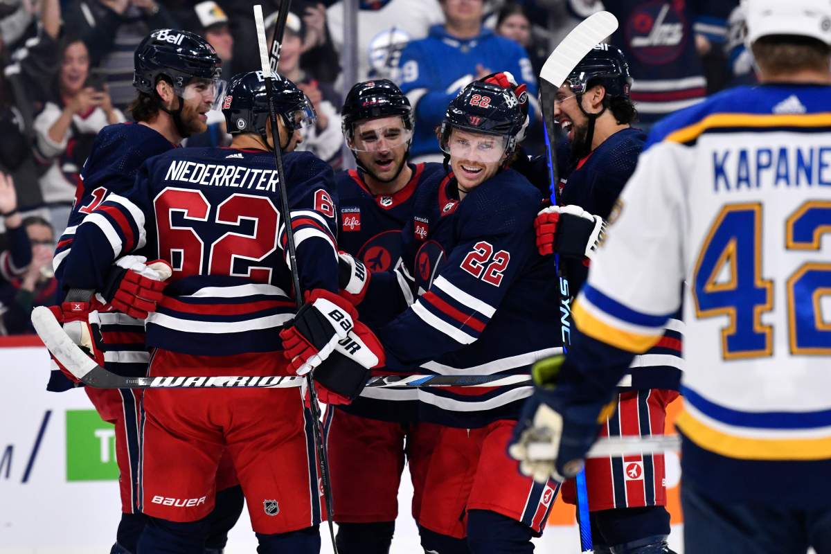 Winnipeg Jets’ Mason Appleton (22) celebrates his goal against the St. Louis Blues with Adam Lowry (17), Nino Niederreiter (62), Neal Pionk (4) and Brenden Dillon (5) during the second period of NHL action in Winnipeg on Tuesday October 24, 2023. THE CANADIAN PRESS/Fred Greenslade